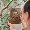 Tranh gỗ "An Tiếu" - hình ảnh chú tiểu mỉm cười khúc khích
